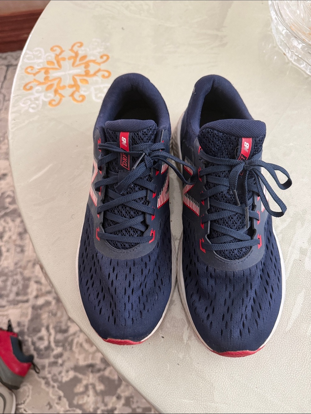 New Balance Kids Navy Sneakers with Red Highlights
